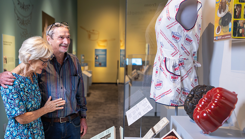 Visitors looking at the objects at the Julia Child Exhibit.